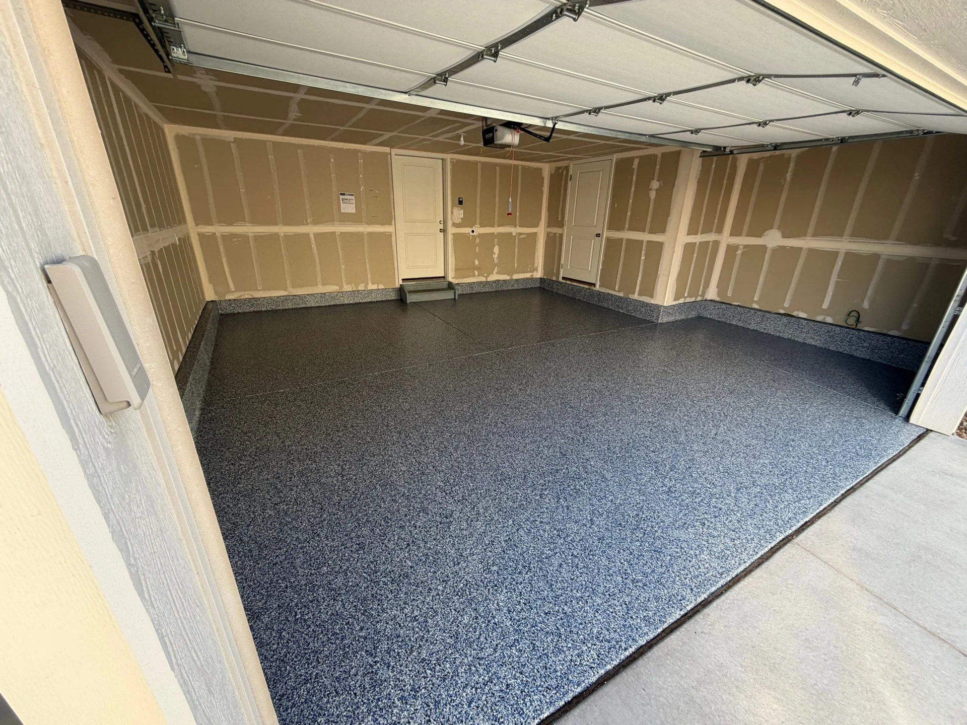 Denver Garage Floor: Blue Polyaspartic with Cove & Flake