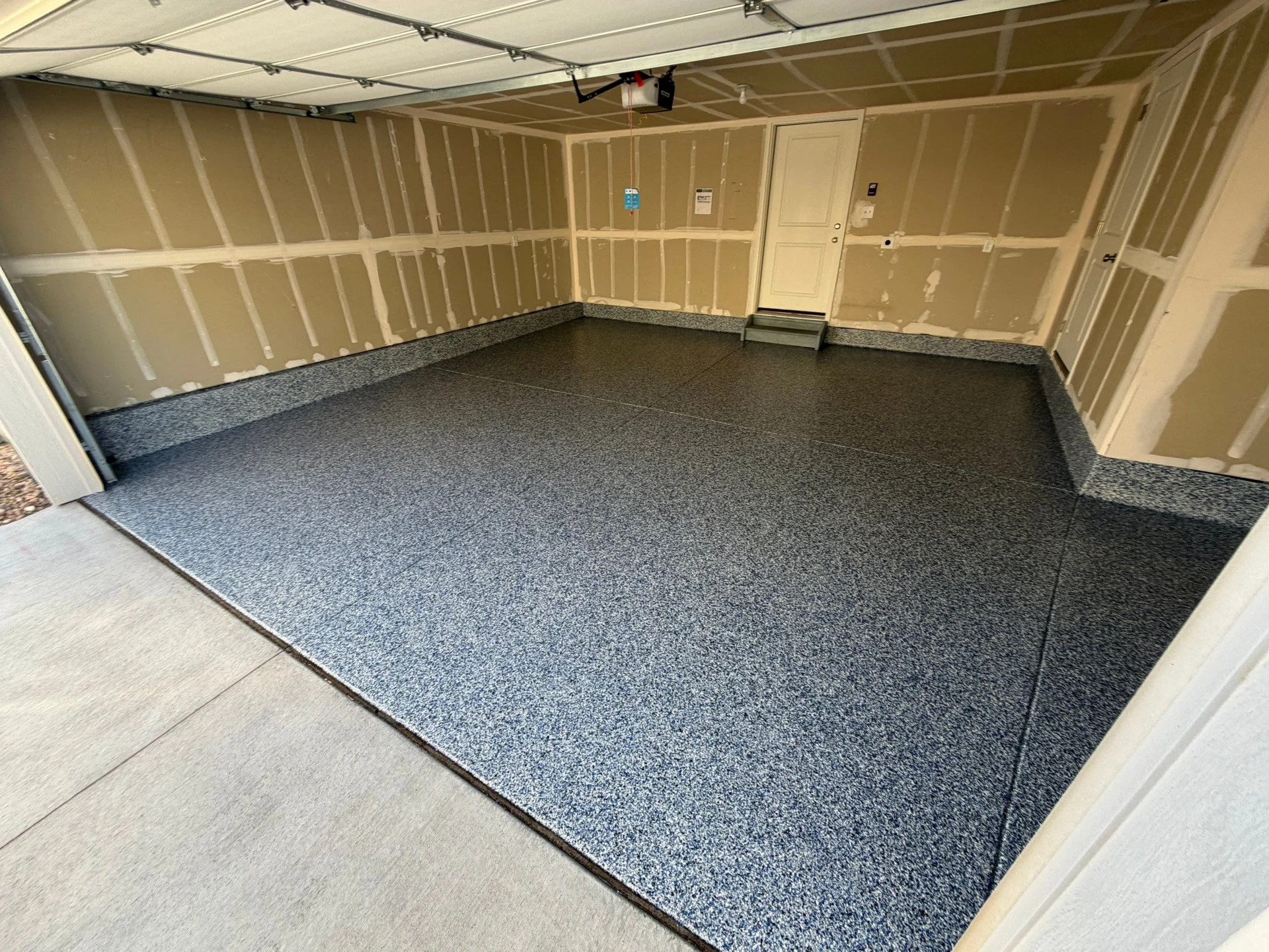 Denver Garage Floor: Blue Polyaspartic with Cove & Flake