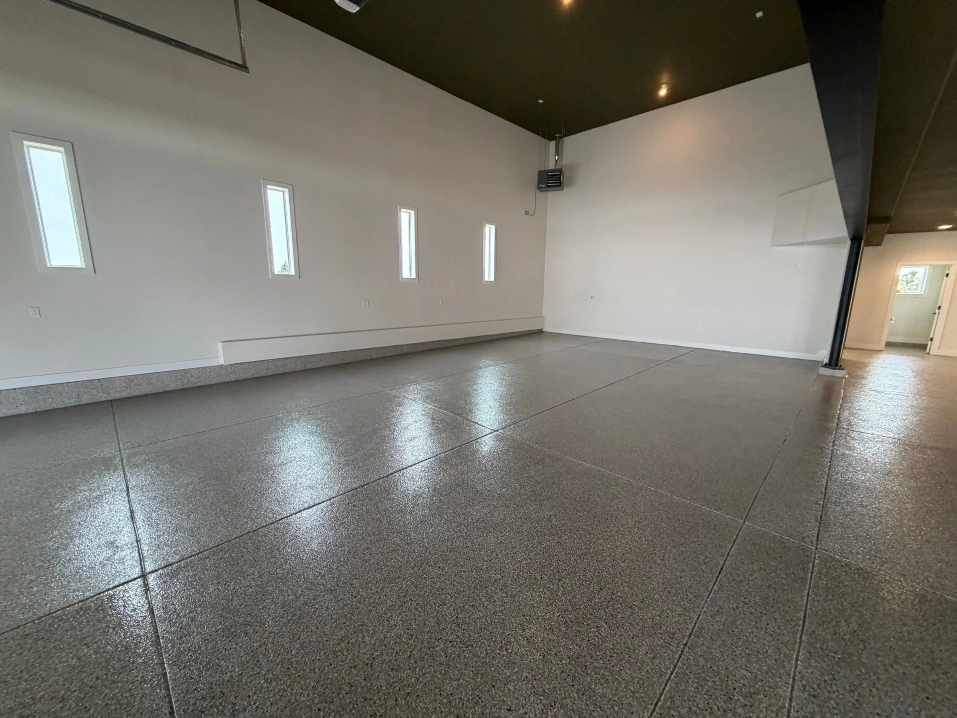 Parker Shop: Polyaspartic Coating & Cove by Solid Custom Floor