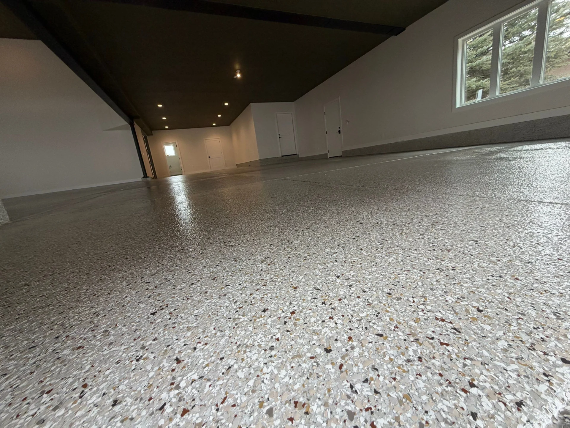 Parker Shop: Polyaspartic Coating & Cove by Solid Custom Floor